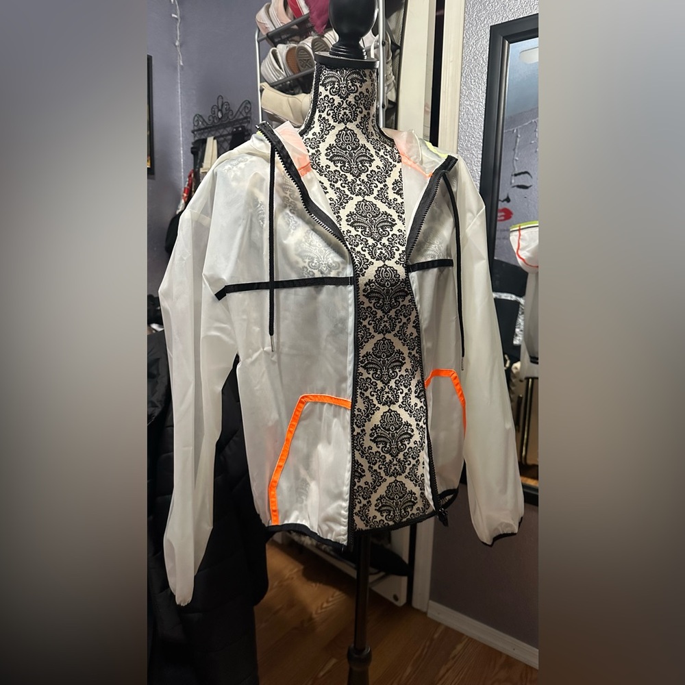 Transparent Hooded Jacket with Orange Accents